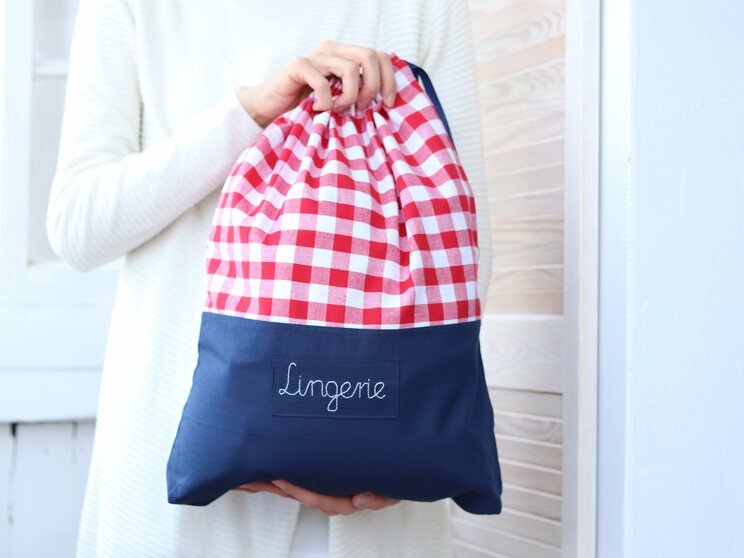 Red And White Checkered Travel Laundry Bag With Navy Blue Bottom