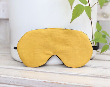 Elegant yellow linen eye mask with adjustable strap